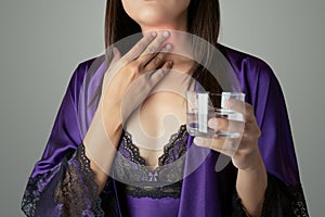 Woman having throat irritation