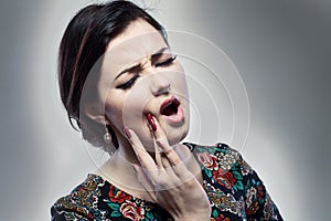 Woman having toothache photo