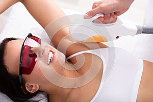 Woman Having Underarm Laser Hair Removal Treatment