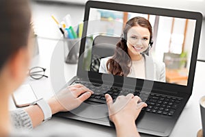 Woman having video call on laptop at office