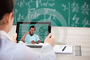 Woman having videochat on digital tablet