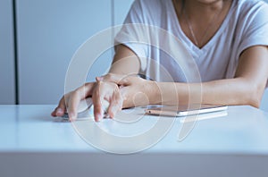 Woman having a wrist or hand pain,Female feeling exhausted and painful,Because clicking the mouse and using computer