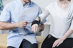 Woman having a wrist stabilizer