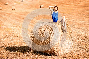 Woman on the hayfield