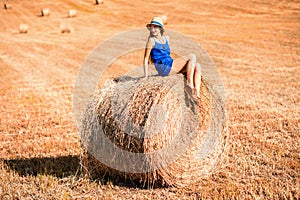 Woman on the hayfield