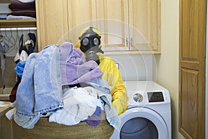 Woman in Haz Mat suit holding basket of laundry