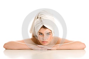 Woman with hair wrapped in towel