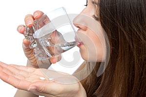 Woman with headache hand take pill medicine tablet and glass of