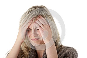 Woman with headache holding her hand to the head