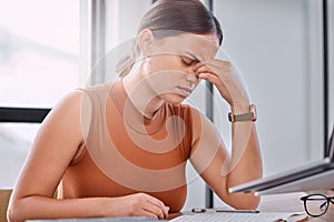 Woman, headache and stress in office with notebook, laptop or worry for deadline, report or mistake. Person, writer and