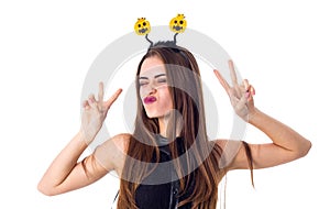 Woman with headband showing PEACE
