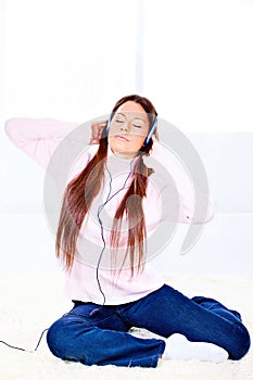 Woman with headphones at home