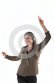 Woman with headphones listening and enjoing music. Girl with headphones dancing.
