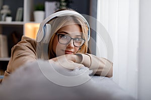 Woman in headphones listening music