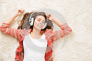 Woman in Headphones Listening Music on Lying on White Carpet, Resting Relaxing Beautiful Happy Girl