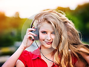 Woman with headphones listening summer music