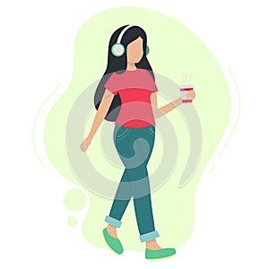 Woman in headphones listening to music while walking.