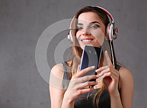 Woman in headphones with smartphone
