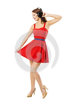 Woman in headpnones dancing listening to music, isolated over white