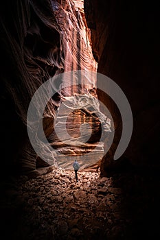 Woman Heads into Tall Slot Canyon in Utah