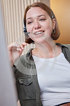 Woman, headset and call center as agent for company support, crm and customer service talking in office. Employee