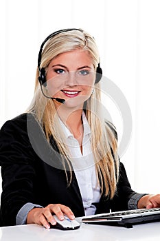 Woman with a headset and computer Hotline