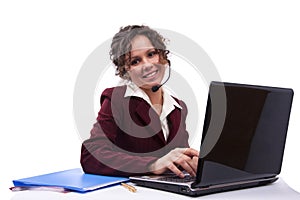 Woman with headset and laptop