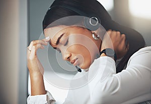 Woman, headset and telemarketing at call centre with headache pain for burnout, fatigue or brain fog. Female person