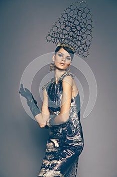 Woman in headwear with spikes