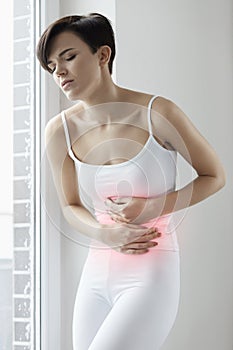 Woman Health. Beautiful Female Feeling Pain In Stomach