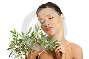 Woman with health skin and with olive tree