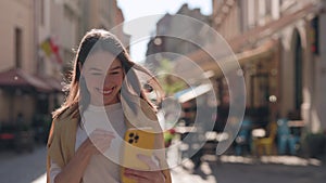 Woman with hearing disorder using smartphone for video call