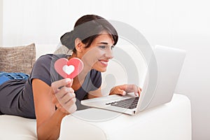 Woman With Heart Shape And Laptop