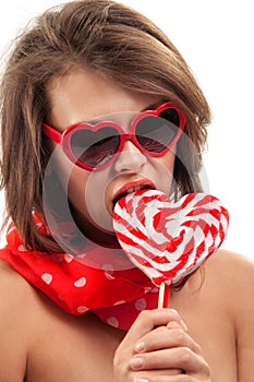 woman with heart shaped lollipop