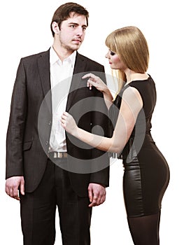 Woman helping man dress up elegant clothes.