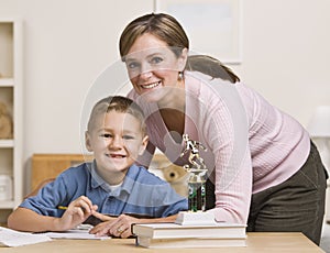 Woman Helping Son with Homework