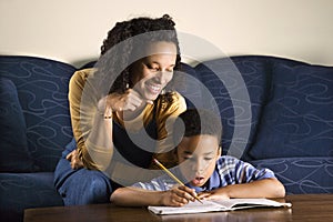 Woman Helping Son with Homework