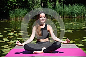 Woman in her 30`s meditating