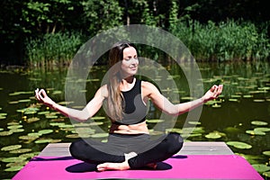 Woman in her 30`s meditating