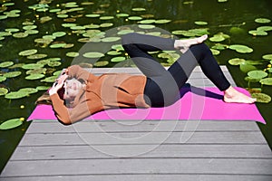 Woman in her 30`s resting at lake