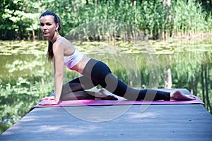 Woman in her 30`s stretching her body