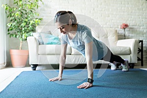 Woman in her 40s exercising at home