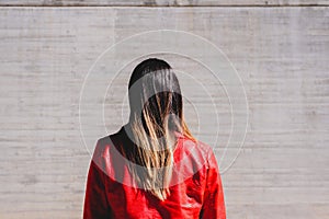 Woman on her back with a casual jacket in a depressing and sad attitude