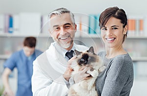 A woman with her cat at the veterinary clinic photo