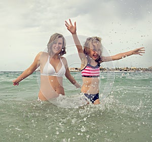 Woman and her daughter having fun.