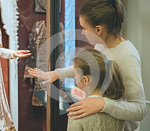 Woman and her daughter in museum.