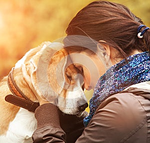 Woman with her dog tender scene photo