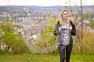 Woman in her forties standing on a mountain