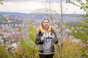 Woman in her forties standing on a mountain