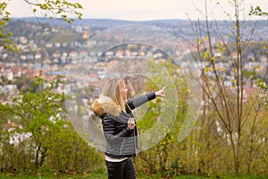 Woman in her forties standing on a mountain